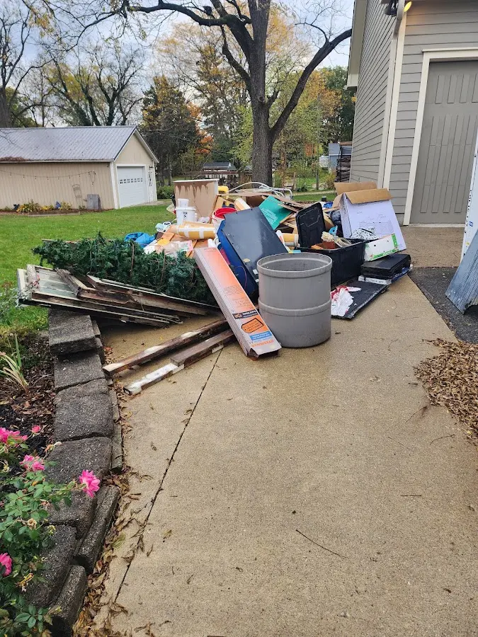 Dumpster being loaded with debris for Commercial Dumpster Rental in Loudon